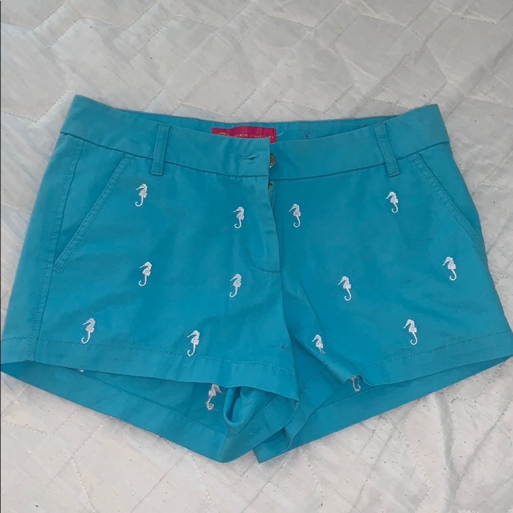 Blue shorts with white seahorses